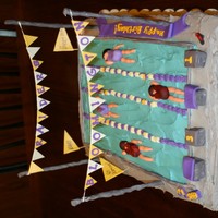 Swim Team Birthday Cake This was my first decorated cake. I made it for my sister-in-law, who is on the high school swim team. Everything went wrong: there were 3...