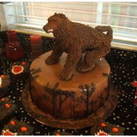 New Moon Werewolf Cake Chocolate cake covered in fondant. Werewolf is made out of rice crispie treats, fondant and royal icing