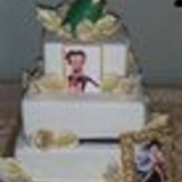 Betty Boop This cake has one vanilla strawberry tier, one black and white and one pineapple. All decorations are gumpaste or chocolate. The two bottom...