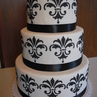 Black And White My first try with cake dummies. White fondant with black royal icing.
