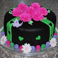 Black And Hot Pink This birthday girl wanted Black Fondant and Hot Pink Carnations with green accents. Only problem was I had to wear sunglass while...