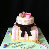Baby Shower Cake 2 tier baby shower cake. Made gumpaste teddy bears, shoes, blocks, safety pins, etc...