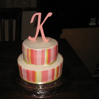 Pink Striped Cake The top tier is chocolate cake, filled with chocolate ganache filling with pecans and chocolate chips. The bottom tier is yellow cake...