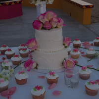 Roses Wedding Cake Bride asked for simple white on white and to add her fresh flowers. This was my first wedding cake.