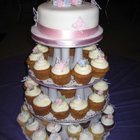 Rose's & Butterflies This was made for a womans 70th Surprise Birthday party. Pink & Purple Fondant Roses & Royal Icing Butterflies, 8" Carrot Cake...