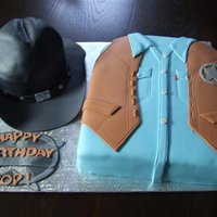 Walker Texas Ranger Cake and hat are chocolate cake with chocolate cream cheese filling.. Hat brim is gumpaste. Inspired by Walker, Texas Ranger...recipient is...