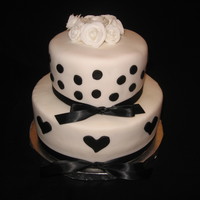 Black And White Fondant And Ribbon Cake Black and White Fondat hearts and dots with Black Silk Ribbon topped with white fondant roses