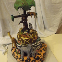 Jungle / Rainforest Cake With Chocolate Tree Jungle/ rainforest cake with gumpaste animals and a chocolate tree.. everything is edible except a few wooden dowels and a peice if wire...