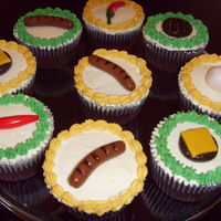 Bbq Themed Cupcake I made these to go with the the bbq cake I made for my husband's birthday bbq. Toppings are all made of fondant.