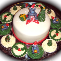 Christmas Themed Mini Cake & Cuppies Cake is covered & decorated with fondant. Toppers are all hand moulded & took hours since it was my first attempt at fondant...