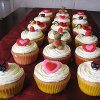 Valentine Cupcakes... Made 4 dozen cupcakes for my kids school.....all toppers are hand moulded using fondant.