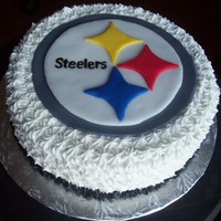Pittsburgh Steelers Cake This is a 2 layer lemon cake filled with whipped buttercream icing. The cake is topped with the same icing and the logo was done with...