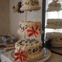 Anniversary Cake Bottom layer was choc., middle layer was white and top layer was coconut with butter cream icing