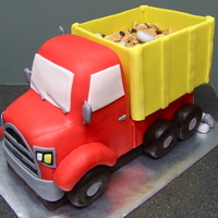 Logan's Dump Truck The entire thing is edible. The tires, fenders and inside of the box is RKT and the rest is marble cake. Also in the box is some graham...