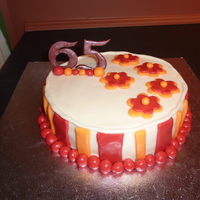 65Th Birthday Cake One of my first cakes. Cake made for my MIL's birthday. Lemon cake (recipe from CC) and wilton raspberry filling. MMF. Numbers made...