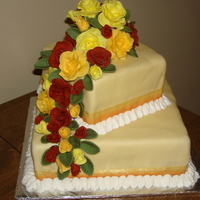 My First Tiered Cake 8" X 8" & 5" X 5" squares. Covered in tinted fondant with ribbon border (attached with vanilla) and butter cream...