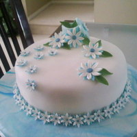 Wilton Course 4 Fondand & Gumpaste Final Cake 9"round again. This course I learned how to marble, and cover base. Also learned daisies, carnations and a few other flowers. Finale...