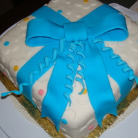 My First Fondant Covered Cake My first cake covered with fondant. Let ribbon set overnight, and after cake was assembled put it in cake carrier so it wouldn't dry...