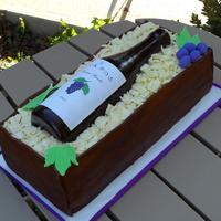 Wine Bottle Chocolate cake, chocolate icing, chocolate fondant, with white chocolate shavings. Everything is edible but the label. Just wanted to make...