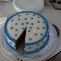 Blue Dots chocolate cake with white buttercream decorated with blue butter cream dots and trim