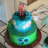 Avatar The Air Bender This cake is covered in Buttercream and there are the air, wind, earth, fire symbols made from MMF around the bottom tier and the Avatar on...
