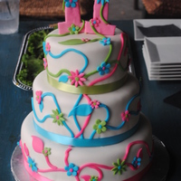 Spring Flowers Graduation 2011 Three tiers. Yellow cake with vanilla buttercream filling and marshmallow fondant. Gumpaste topper.