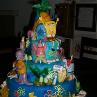 Sponge Bob And His Friends There's not one piece of plastic on this cake. The characters, sea shells and pineapple leaves were created out of gumpaste, modeling...