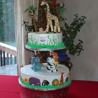King Of The Nursery Buttercream cake, animals were created using rice crispies, then wrapped in fondant. The baby was sculpted MANUALLY before I knew there is...