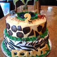 Safari Cake All buttercream with fondant cut outs. Plastic animals.