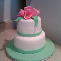 Engagement Cake This was an engagement cake for my father in law. Chocolate cake covered in fondant with gumpaste tulips and leaves.