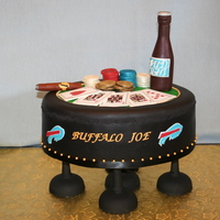 Poker Table Yellow cake with chocolate filling, covered with black fondant. Playing cards are gumpaste with edible transfers. Beer bottle and poker...