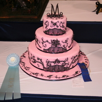 Three Tiered Wedding Cake Pink Fondant with black royal icing leaves and vines. Black royal icing string work. My first attempt at string work.