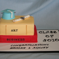 Graduation Cake Yellow and chocolate cakes covered in fondant to make look like books. Cap was a small wonder pan with the top cut off. Made the diploma...