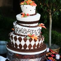 Chocolate_Whismy.jpg Cream colored fondant with chocolate fondant accents. Gumpaste callas.