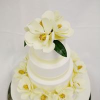 Fondant Cake And Gumpaste Magnolias Fondant covered cake. Magnolias are made of gumpaste.