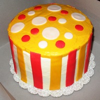 Orange & Yellow Cake This was made for Thanksgiving. It is a yellow cake with BC Icing. I used red & orange fondant stripes & polka dots as accents....