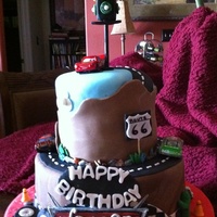Pixar Cars Pixar CARS theme for a 1 year old. Rich chocolate cake with buttercream and fondant covering. First try at a bit of "spiral"....