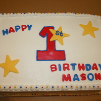 First Birthday Cake I did this cake for a friend, for her son's first birthday. It is a double layer cake, covered in buttercream, and the accents are MMF...