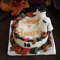 Halloween Anniversary Cake Red velvet cake with cream cheese frosting and fondant accents.