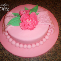 Hot Pink Fantasy Flower Cake Final cake for Wilton course 4. Hot pink fondant, draped cloths, and fantasy flowers.