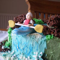 Butterceam Canoe Made for my friends husband, this is as close as he's allowed who want a Pyranha canoe... Buttercream with chocolate crispie rocks.