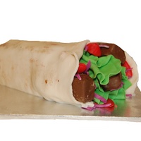 Souvlaki This was made for a guy at work who loves souvlakis. It is a white chocolate mud cake wrapped in ivory fondant with fondant lettuce, tomato...