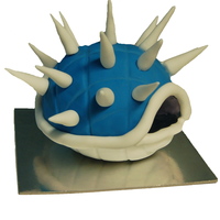 Blue Spikey Koopa Shell Designed to look like a blue spikey koopa shell from the Mario Brothers games, it is a Peppermint Slice Mud cake with choc mint ganache...