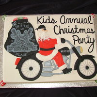 Company Christmas Party Half Chocolate, half Vanilla. This cake is all done in fondant. Santa's sack is hand painted to match the company's logo.