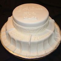 Ava's Day Bottom tier is Vanilla, top tier is Chocolate. BOth cakes are filled with buttercream and strawberries. Cake is covered in fondant and...