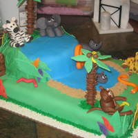 Animal Jungle Cake Johnny's second birthday cake, First animal figures I have ever made .50/50 gum paste/fondant mix.BC covered with fondant on both...