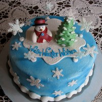 Warm Winter Wishes This cake is covered with buttercream and sprayed with blue food coloring. I hand sculpted the snowman and tree and the snowflakes were cut...
