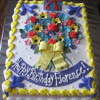 Bouquet Of Flowers Hi there,This cake is covered with buttercream.All the flowers and accents are made from fondant.Thanks for looking.