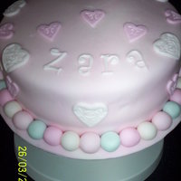 Hearts And Flowers 8in vanilla cake with vanilla buttercream, covered in fondant with fondant accents. This was made in an awful hurry today as a suprise, to...