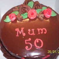 Chocolate Heaven I made this for a friend's Mum who turns 50 this Sunday.Chocolate cake with chocolate ganache buttercream, covered in ganache,...
